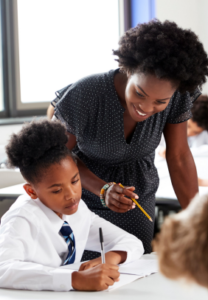 Image of a teacher helping a student with their work