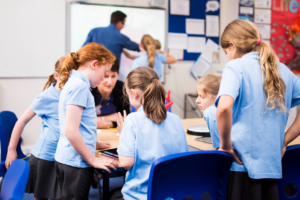 Primary school children learning in class